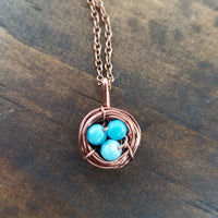 Nestling Necklace with Blue Stones