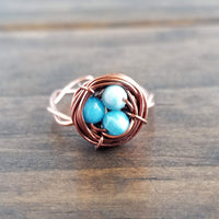 Nestling Ring with Blue Stones