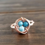 Nestling Ring with Blue Stones