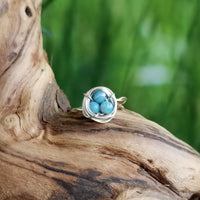 Nestling Ring with Blue Stones