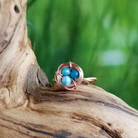 Nestling Ring with Blue Stones