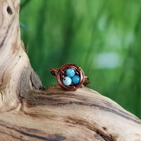 Nestling Ring with Blue Stones