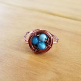 Nestling Ring with Blue Stones