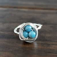 Nestling Ring with Blue Stones