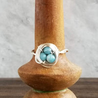 Nestling Ring with Blue Stones